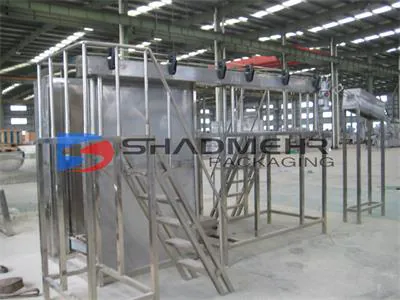 Open enclosure around a can filling machine in the workshop