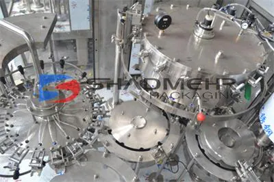 Top view of the tanks and heads of a carbonated drink filler