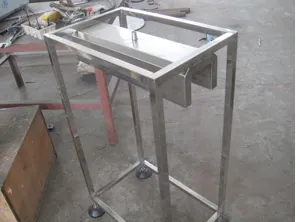 Open metal frame of a container heat shrink machine