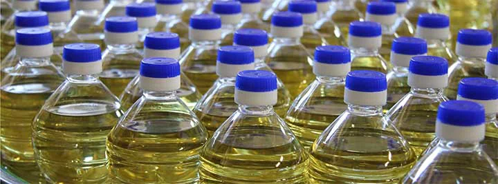 Cooking oil bottles on a production conveyor