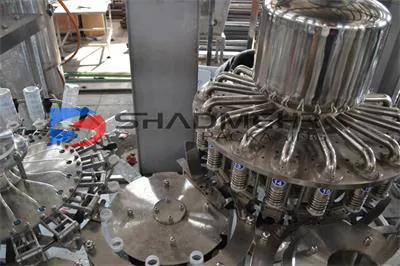 Top view of a hot filling machine tank with product pipework