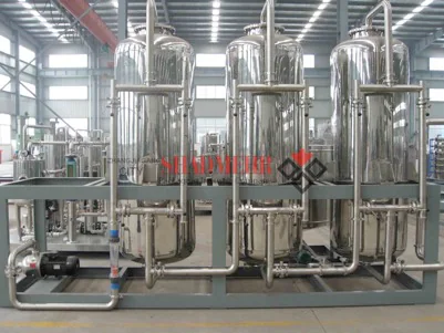 Stainless steel ion exchange vessels connected by pipework