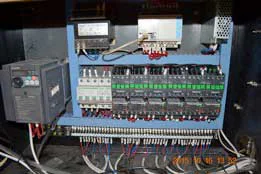 Open electrical cabinet with controllers relays and wiring