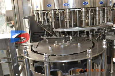 Close view of a cooking oil filling turret and numbered heads