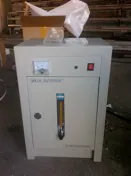 White ozone generator cabinet with a vertical flow indicator