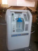 Compact ozone generator with visible controls and flow indicator