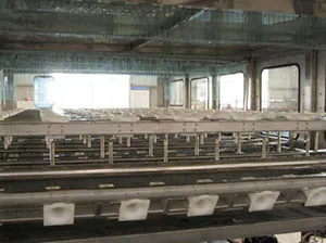 Interior rollers and container guides inside the QGF1500 machine