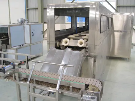 Large container conveyor beside QGF300 filling equipment