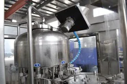 Upper tank and filling heads of a stainless steel rotary filler