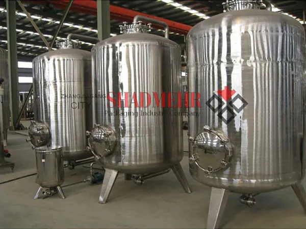Two stainless steel water storage tanks in the workshop