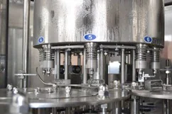 Numbered filling heads on a three in one filling machine
